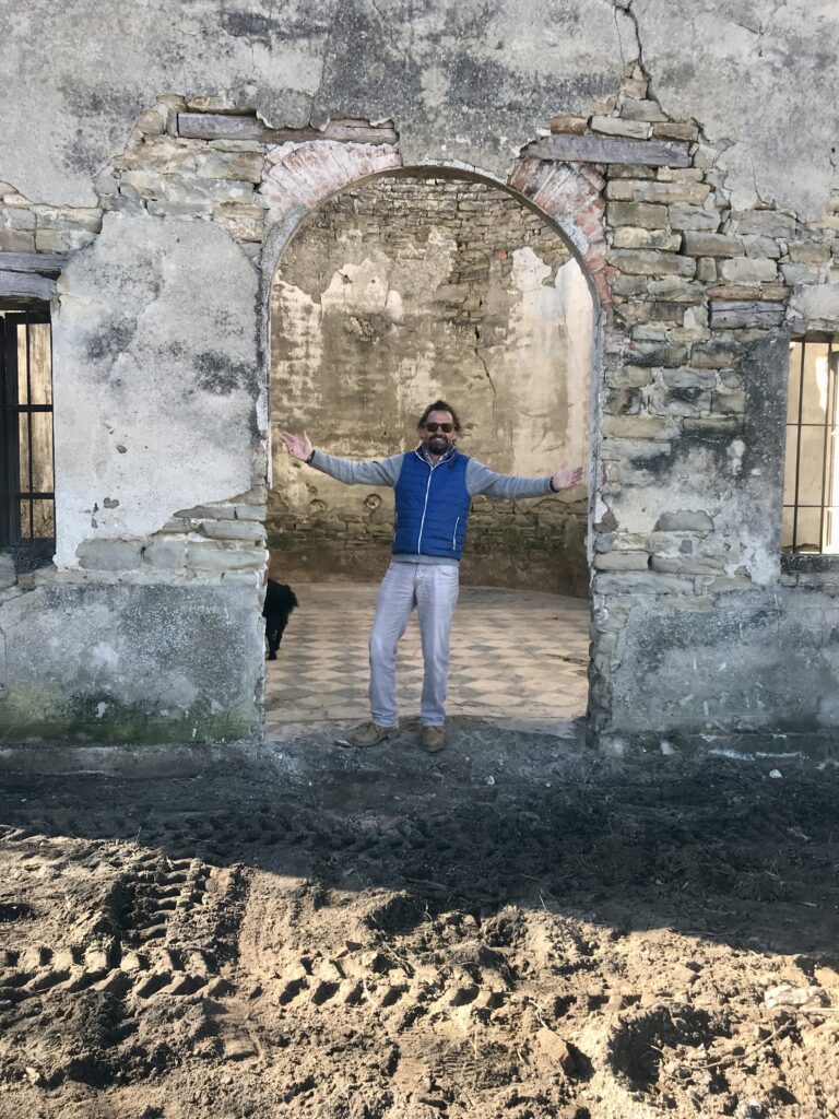 Me standing in the entrance of the old church on the day we discovered the beautiful old tiles